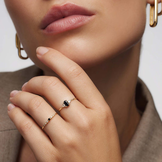 Black spinel ring with baguettes