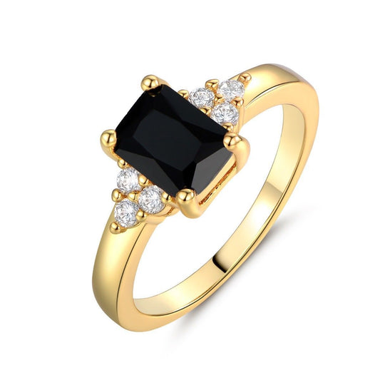 Black spinel ring with baguettes